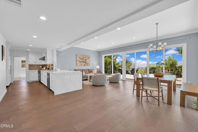 320 Starlane Dr, La Canada Flintridge, CA 91011 - living area with wood finished floors, a chandelier, recessed lighting, and crown molding