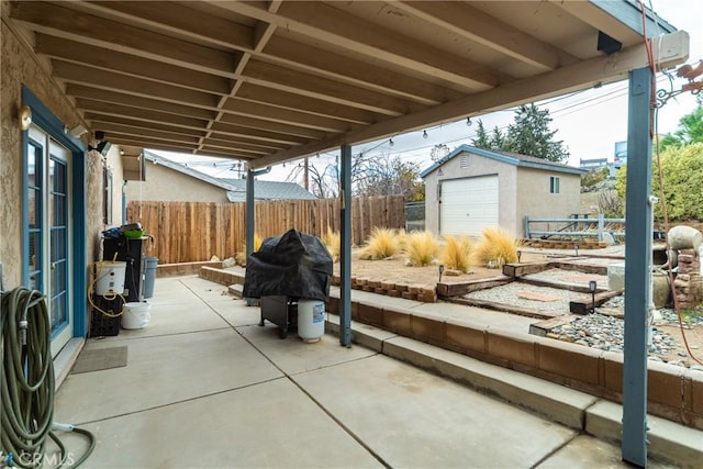 42868 Ranch Club Rd, Lake Elizabeth, CA 93532 - fenced backyard with a patio area, grilling area, and an outdoor structure