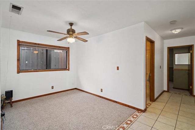42868 Ranch Club Rd, Lake Elizabeth, CA 93532 - unfurnished room with a ceiling fan, baseboards, a smoke detector, light carpet, and light tile patterned floors