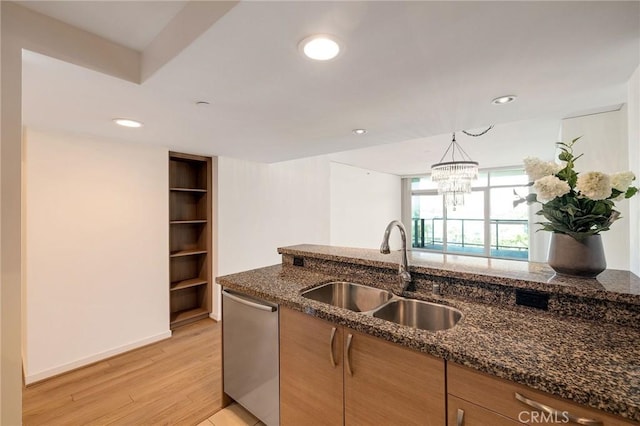 13650 Marina Pointe Dr Unit 908, Marina Del Rey, CA 90292 - kitchen with stainless steel dishwasher, a sink, dark stone counters, light wood-style floors, and recessed lighting