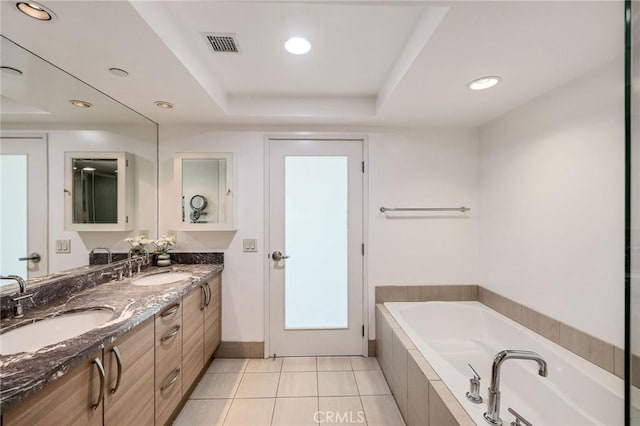 13650 Marina Pointe Dr Unit 908, Marina Del Rey, CA 90292 - full bath featuring double vanity, a bath, recessed lighting, tile patterned flooring, and a raised ceiling