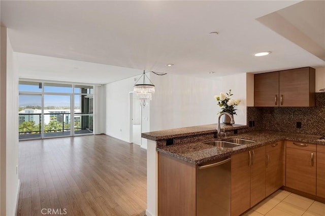 13650 Marina Pointe Dr Unit 908, Marina Del Rey, CA 90292 - kitchen with a sink, stainless steel dishwasher, a peninsula, open floor plan, and floor to ceiling windows