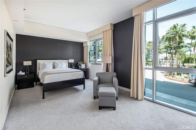 13650 Marina Pointe Dr Unit 908, Marina Del Rey, CA 90292 - bedroom featuring multiple windows, baseboards, carpet flooring, and an accent wall