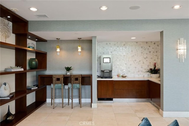 13650 Marina Pointe Dr Unit 908, Marina Del Rey, CA 90292 - kitchen featuring light countertops, recessed lighting, brown cabinets, modern cabinets, and baseboards