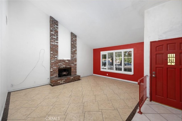 4060 Olive St, Chino, CA 91710 - unfurnished living room with lofted ceiling, a brick fireplace, and baseboards