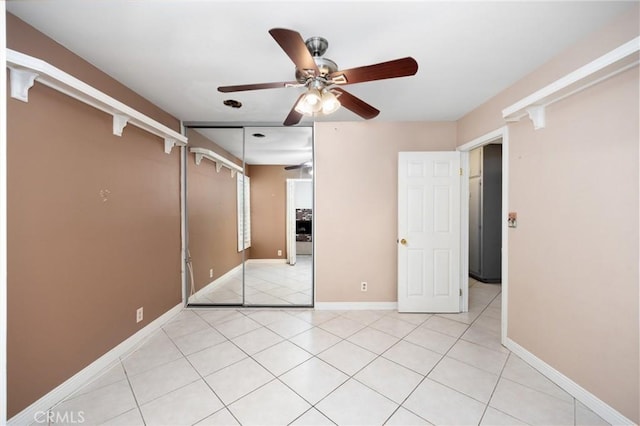 4060 Olive St, Chino, CA 91710 - unfurnished bedroom with light tile patterned floors, baseboards, and a ceiling fan