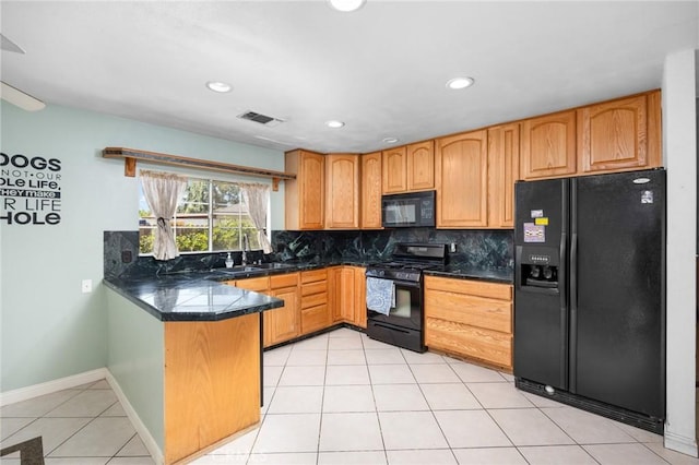 4060 Olive St, Chino, CA 91710 - kitchen with black appliances, a peninsula, decorative backsplash, a sink, and light tile patterned flooring