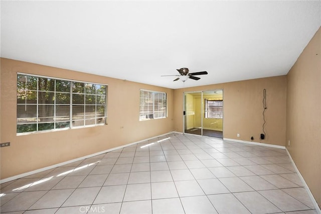 4060 Olive St, Chino, CA 91710 - spare room with healthy amount of natural light, a ceiling fan, baseboards, and light tile patterned flooring