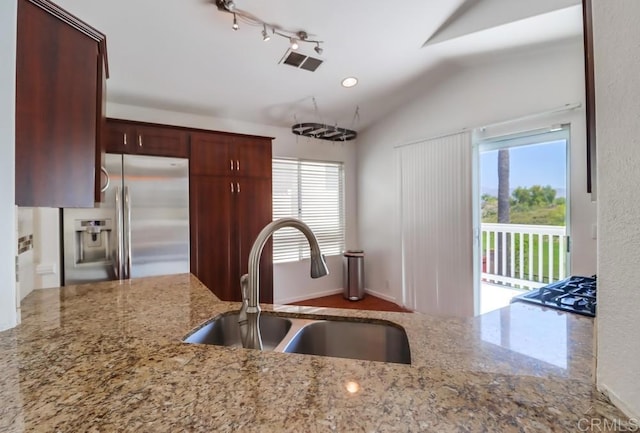 2407 Eastridge Loop, Chula Vista, CA 91915 - kitchen featuring stainless steel fridge with ice dispenser, a sink, plenty of natural light, light stone counters, and vaulted ceiling