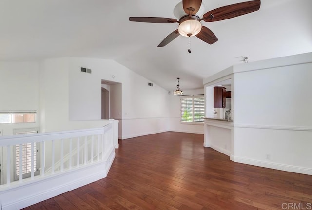 2407 Eastridge Loop, Chula Vista, CA 91915 - unfurnished living room with lofted ceiling, a chandelier, wood finished floors, a ceiling fan, and baseboards