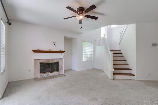 2407 Eastridge Loop, Chula Vista, CA 91915 - unfurnished living room with a ceiling fan, stairs, a fireplace, and carpet floors
