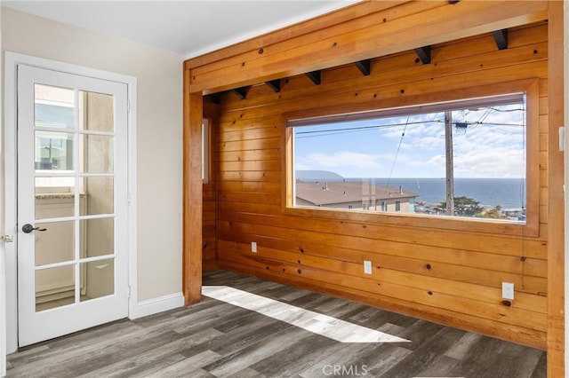 833 Park Ave, Cayucos, CA 93430 - unfurnished room featuring healthy amount of natural light, wood finished floors, wooden walls, and baseboards