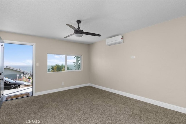 833 Park Ave, Cayucos, CA 93430 - carpeted empty room with a wall mounted air conditioner, a ceiling fan, baseboards, and a textured ceiling