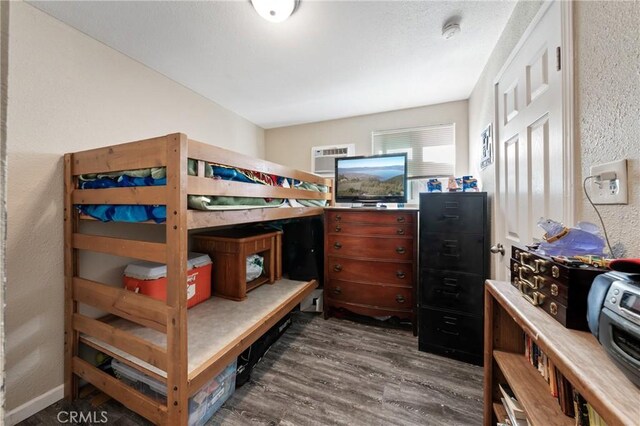 3970 Oakland Ave, Clearlake, CA 95422 - bedroom featuring dark wood-type flooring and a textured wall