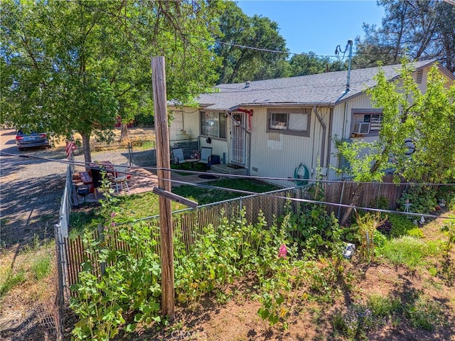 3970 Oakland Ave, Clearlake, CA 95422 - view of front facade with roof with shingles and cooling unit