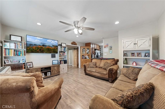 3970 Oakland Ave, Clearlake, CA 95422 - living area with light wood-type flooring, a ceiling fan, recessed lighting, and a barn door