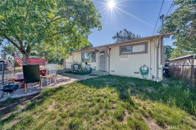 3970 Oakland Ave, Clearlake, CA 95422 - rear view of house with a fenced backyard, a patio, and entry steps
