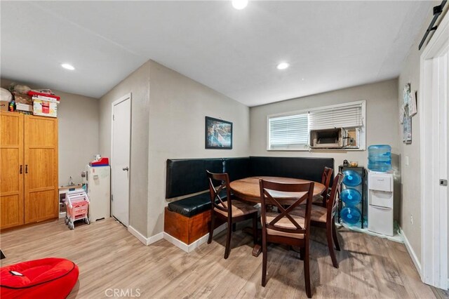 3970 Oakland Ave, Clearlake, CA 95422 - dining area with light wood-style flooring, recessed lighting, and cooling unit