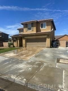 44423 Byron St, Lancaster, CA 93535 - view of front of property with an attached garage, a tile roof, driveway, and stucco siding