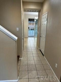 44423 Byron St, Lancaster, CA 93535 - corridor featuring light tile patterned floors and baseboards