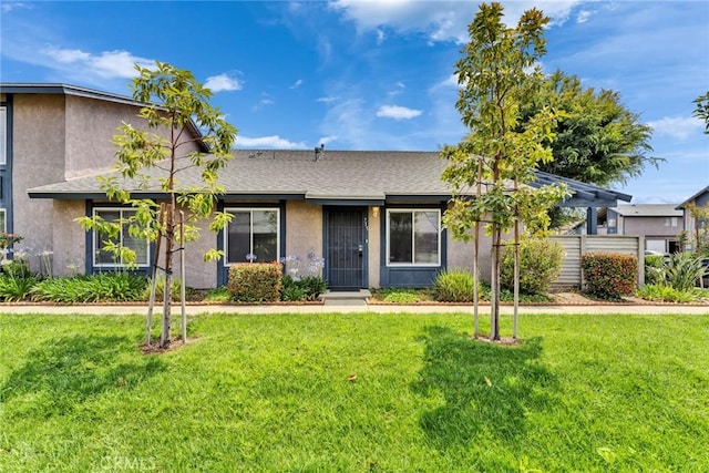 715 Windwood Dr, Walnut, CA 91789 - view of front of house featuring stucco siding, a front lawn, and a shingled roof