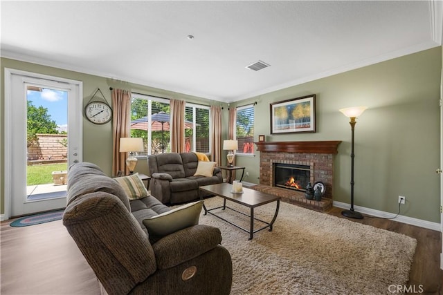 1625 Valley Falls Ave, Redlands, CA 92374 - living room with wood finished floors, ornamental molding, plenty of natural light, baseboards, and a brick fireplace