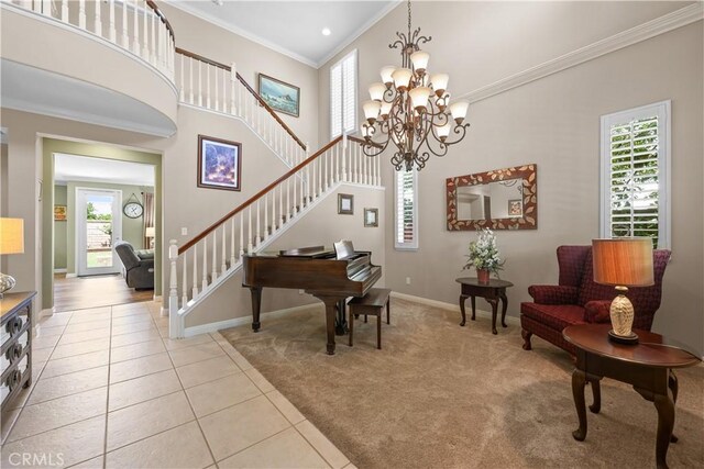 1625 Valley Falls Ave, Redlands, CA 92374 - carpeted entryway with ornamental molding, stairs, tile patterned flooring, a chandelier, and a towering ceiling
