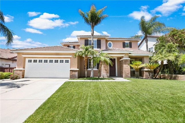 1625 Valley Falls Ave, Redlands, CA 92374 - view of front of house featuring stucco siding, a garage, driveway, and a front yard