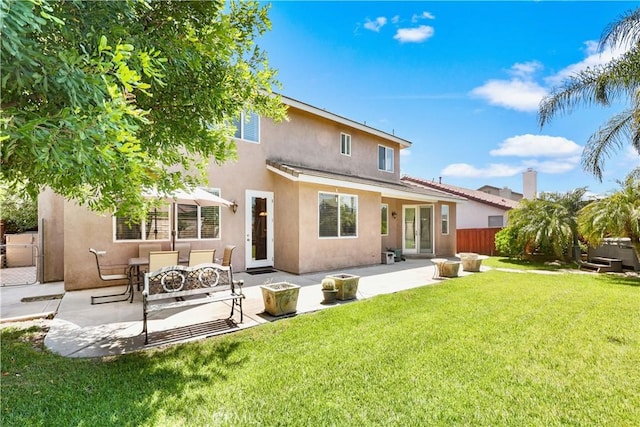 1625 Valley Falls Ave, Redlands, CA 92374 - back of house with stucco siding and a patio area