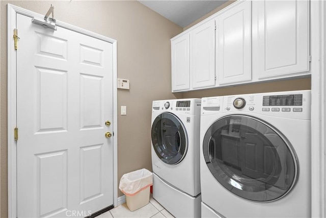 1625 Valley Falls Ave, Redlands, CA 92374 - laundry area featuring washing machine and dryer, cabinet space, and light tile patterned floors