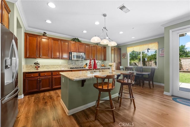 1625 Valley Falls Ave, Redlands, CA 92374 - kitchen featuring appliances with stainless steel finishes, crown molding, plenty of natural light, dark wood-style floors, and recessed lighting