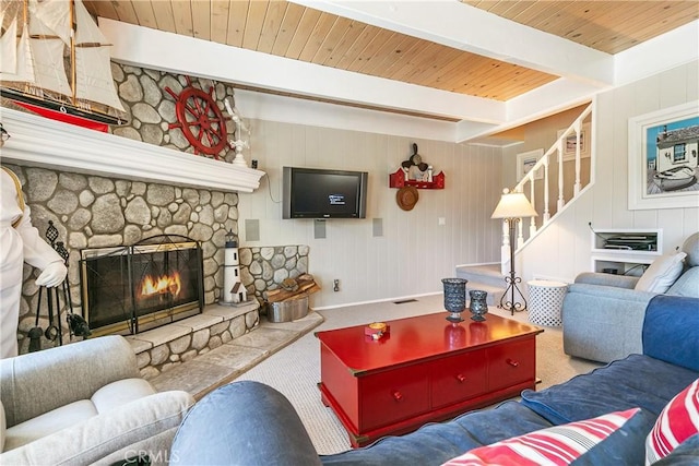 27888 W Shore Rd, Lake Arrowhead, CA 92352 - living room featuring wood ceiling with exposed beams, a fireplace, carpet, stairs, and baseboards
