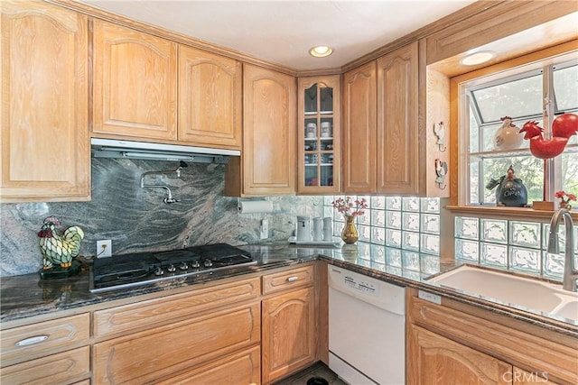 27888 W Shore Rd, Lake Arrowhead, CA 92352 - kitchen with white dishwasher, a sink, stainless steel gas stovetop, glass insert cabinets, and under cabinet range hood