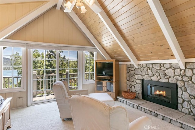 27888 W Shore Rd, Lake Arrowhead, CA 92352 - carpeted living area featuring wooden ceiling, plenty of natural light, a stone fireplace, and a ceiling fan