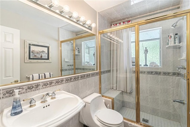 27888 W Shore Rd, Lake Arrowhead, CA 92352 - bathroom with a sink, a stall shower, toilet, and tile walls