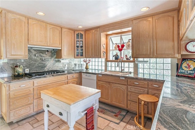 27888 W Shore Rd, Lake Arrowhead, CA 92352 - kitchen featuring stainless steel gas stovetop, a sink, light brown cabinets, glass insert cabinets, and tasteful backsplash
