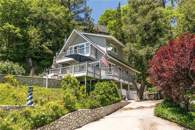 27888 W Shore Rd, Lake Arrowhead, CA 92352 - view of front of house with concrete driveway and a deck