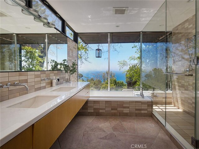 7 Cinchring Rd, Rolling Hills, CA 90274 - full bath featuring plenty of natural light, double vanity, a garden tub, and a shower stall