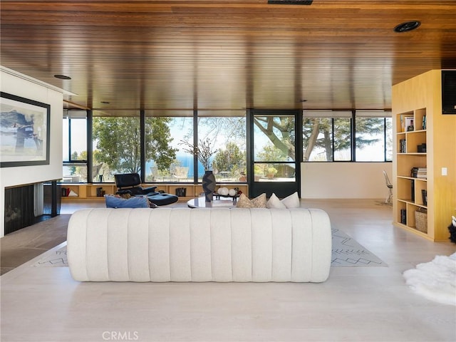 7 Cinchring Rd, Rolling Hills, CA 90274 - living area with wooden ceiling and a fireplace with flush hearth