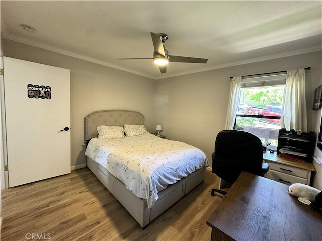 680 Chorro St Unit 18, San Luis Obispo, CA 93401 - bedroom featuring wood finished floors, ornamental molding, ceiling fan, and a desk