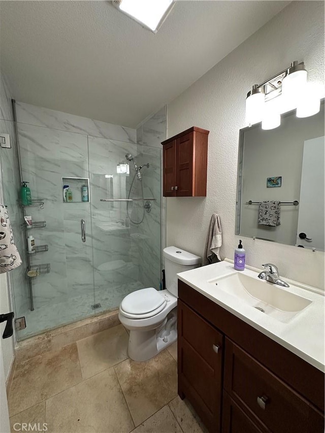 680 Chorro St Unit 18, San Luis Obispo, CA 93401 - bathroom with vanity, a stall shower, toilet, and a textured wall
