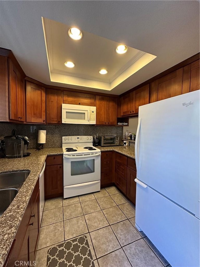 680 Chorro St Unit 18, San Luis Obispo, CA 93401 - kitchen featuring white appliances, a tray ceiling, dark stone counters, recessed lighting, and light tile patterned flooring