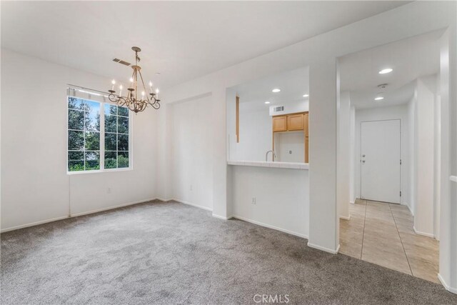 614 Timberwood, Irvine, CA 92620 - unfurnished room featuring light colored carpet, a chandelier, recessed lighting, baseboards, and a sink