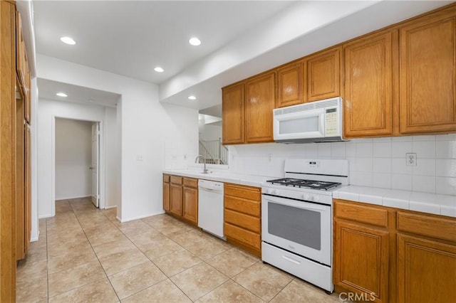 614 Timberwood, Irvine, CA 92620 - kitchen with white appliances, brown cabinets, a sink, and recessed lighting