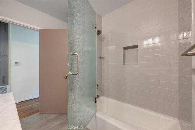 436 W Porter Ave, Fullerton, CA 92832 - bathroom featuring wood finished floors, shower / bath combination, and a heating unit