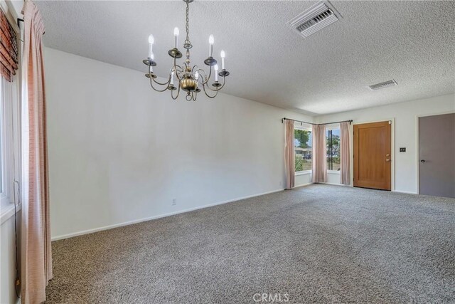 436 W Porter Ave, Fullerton, CA 92832 - carpeted empty room with a chandelier, a textured ceiling, and baseboards