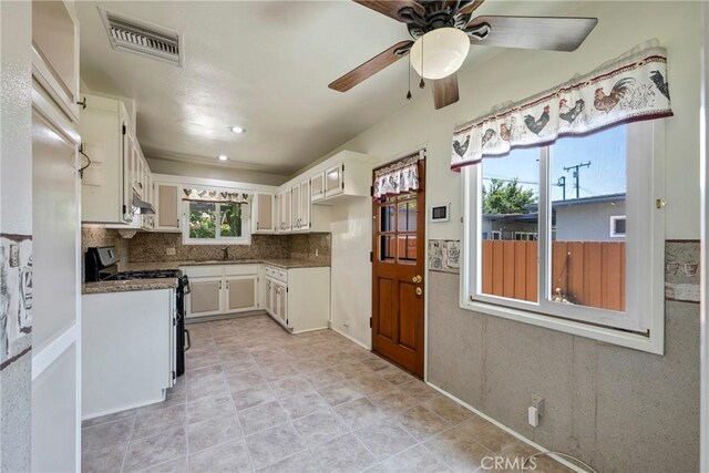 436 W Porter Ave, Fullerton, CA 92832 - kitchen with stainless steel gas range, ceiling fan, white cabinetry, backsplash, and a sink