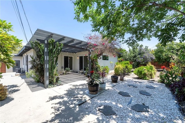 436 W Porter Ave, Fullerton, CA 92832 - back of house with a pergola, stucco siding, and a patio area