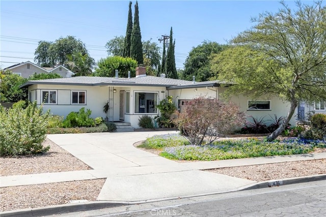 436 W Porter Ave, Fullerton, CA 92832 - ranch-style house featuring a chimney, stucco siding, and driveway