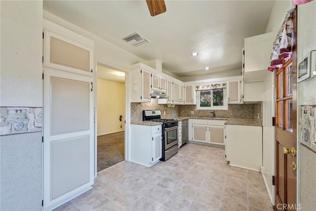 436 W Porter Ave, Fullerton, CA 92832 - kitchen featuring stainless steel appliances, a sink, decorative backsplash, under cabinet range hood, and light tile patterned flooring